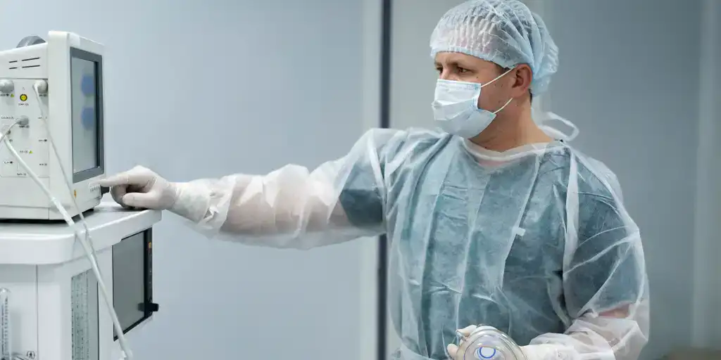 a doctor using a lab machine